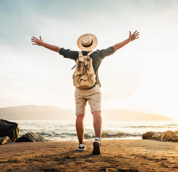 Traveler with arms outstretched